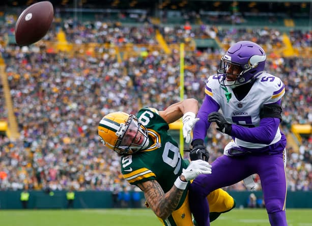 Mekhi Blackmon defends a pass intended for Christian Watson at Lambeau Field.