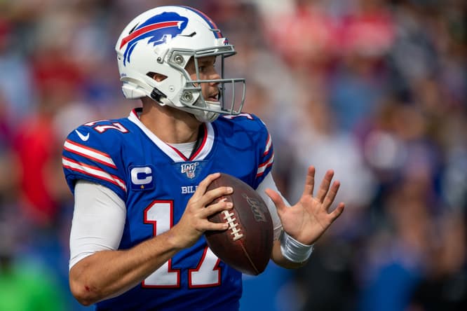 Josh Allen looks to throw a pass during a Bills game against the Patriots. Justin Jefferson