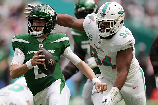 Christian Wilkins and Zach Wilson in 2022
