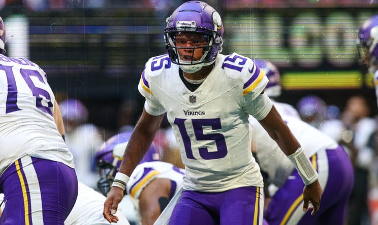 Joshua Dobbs calls a play during a Vikings game against the Atlanta Falcons. former Vikings quarterbacks