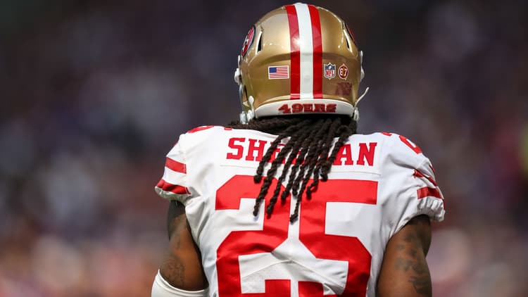 Richard Sherman stands on the field before a game against the Vikings at U.S. Bank Stadium. Nolan Teasley