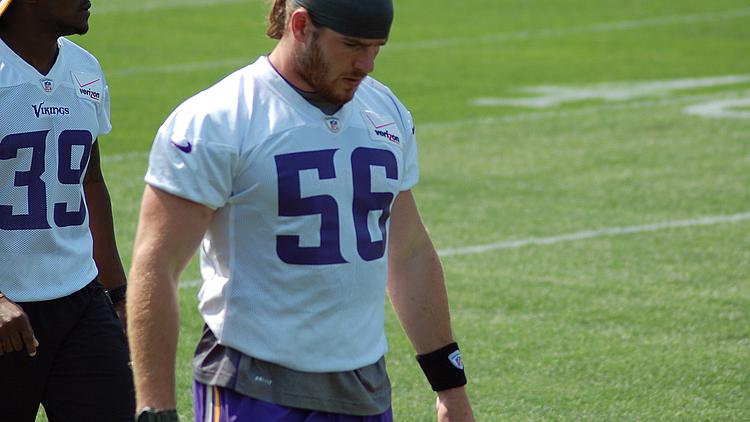 Vikings player wearing number 56 jersey on field during practice.