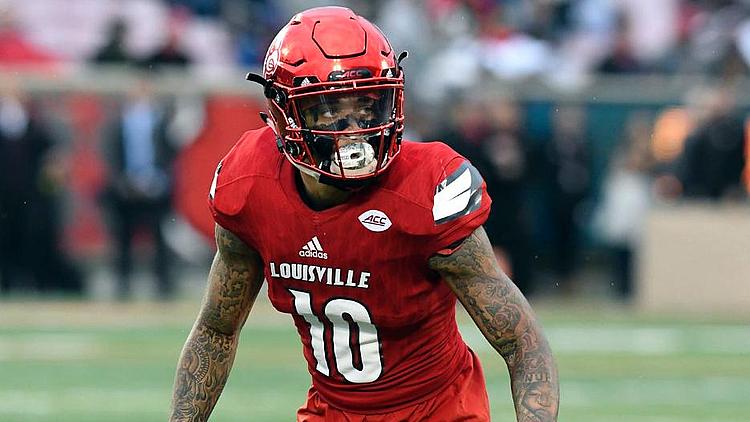 Football player wearing red Louisville jersey number 10 on field.