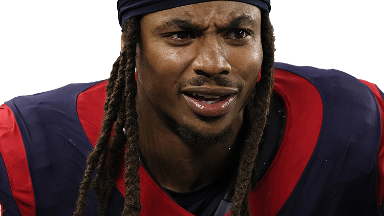 Player wearing Minnesota Vikings navy and red jersey against black background.