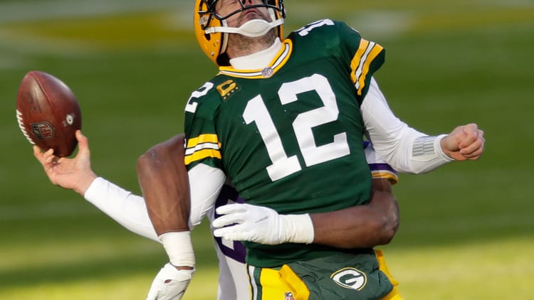 Aaron Rodgers and D.J. Wonnum