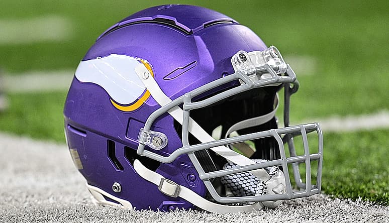 A Minnesota Vikings helmet sits on the turf before a game against the Chicago Bears.