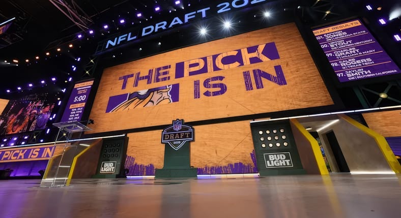 Video board on NFL Draft stage showing “The Pick Is In” for the Minnesota Vikings during the third round in Green Bay