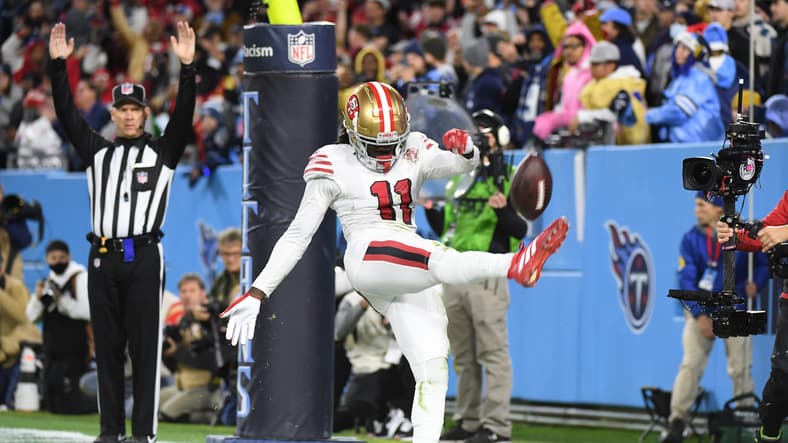 Brandon Aiyuk celebrating after a touchdown against the Titans