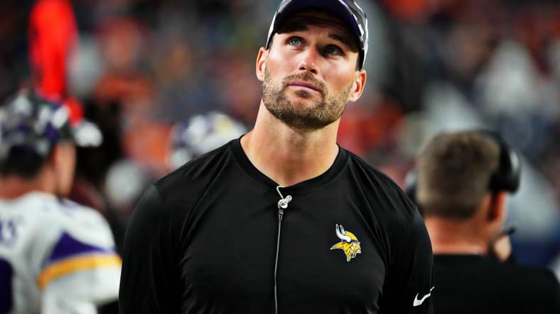 Kirk Cousins drops back to pass for the Vikings in preseason action against the Broncos at Empower Field.