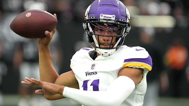 Vikings quarterback Kellen Mond throws a pass against the Raiders.
