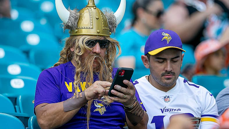 Minnesota Vikings fan raises support during the 2022 game against the Dolphins in Florida.