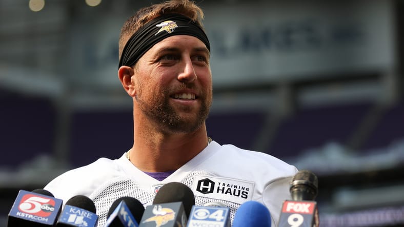 Adam Thielen speaks with media members after Vikings training camp in Minneapolis.