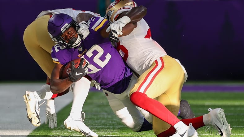 Ty Chandler is tackled by Tariq Castro-Fields during a Vikings preseason game against the 49ers.