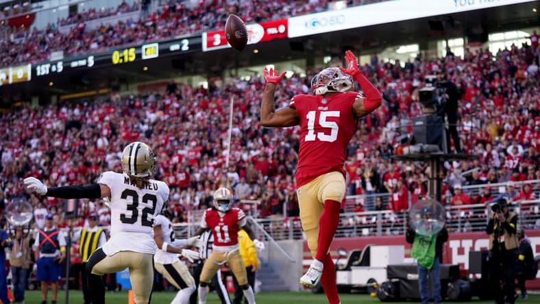 Jauan Jennings catches a touchdown pass near Tyrann Mathieu during a 49ers game. Jauan Jennings Vikings