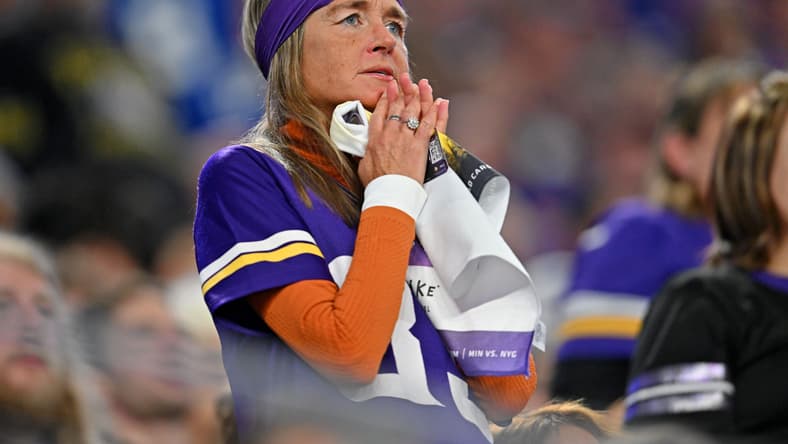 Vikings fans cheer and react in the stands during a playoff game at U.S. Bank Stadium.