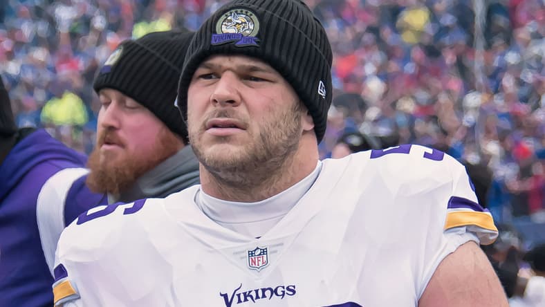 Garrett Bradbury stands on the sideline before a Vikings game against the Buffalo Bills. Vikings predictions