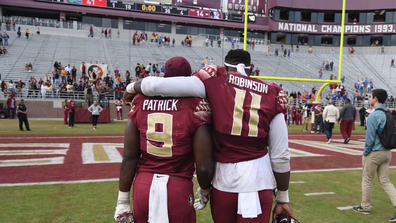 Jacques Patrick and Janarius Robinson walk off the field after Florida State played Florida at Doak Campbell Stadium. Vikings rumors