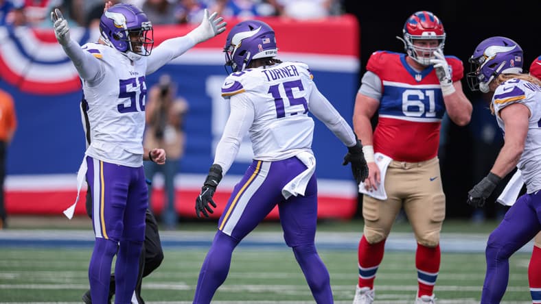 Minnesota Vikings linebacker Jonathan Greenard and Dallas Turner celebrate a sack against the Giants.