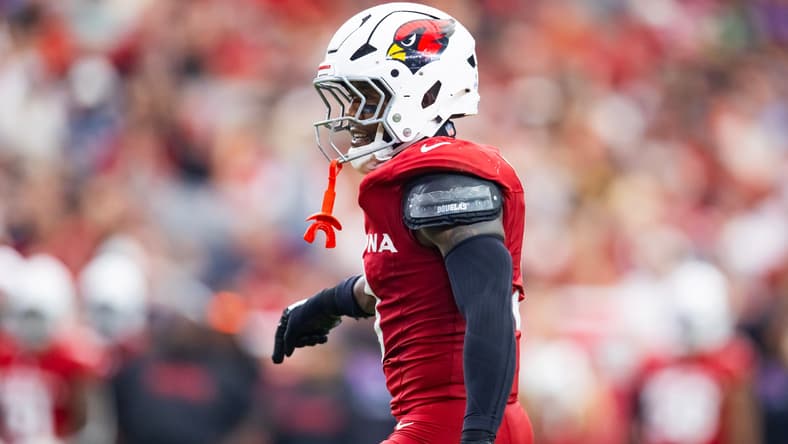 Riley Moss practices catching passes during Broncos pregame warmups in Cincinnati.