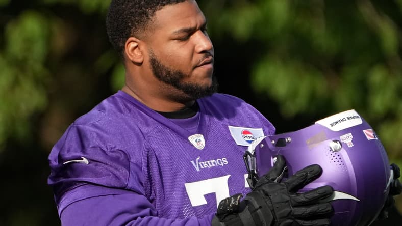 Christian Darrisaw practices with the Vikings in the United Kingdom in 2024. Vikings offense