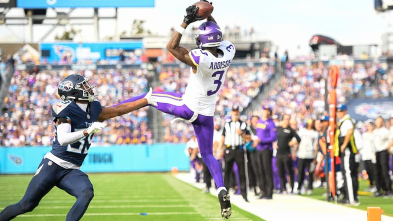 Jordan Addison makes a contested catch against the Titans