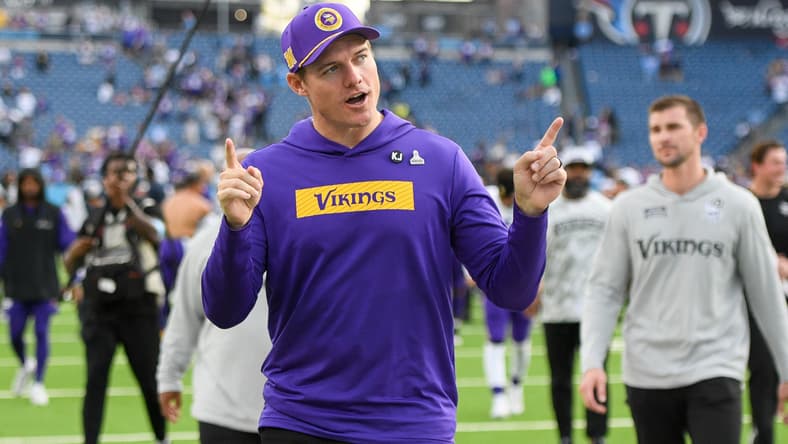 Vikings head coach Kevin O’Connell points to fans while exiting the field against the Titans.