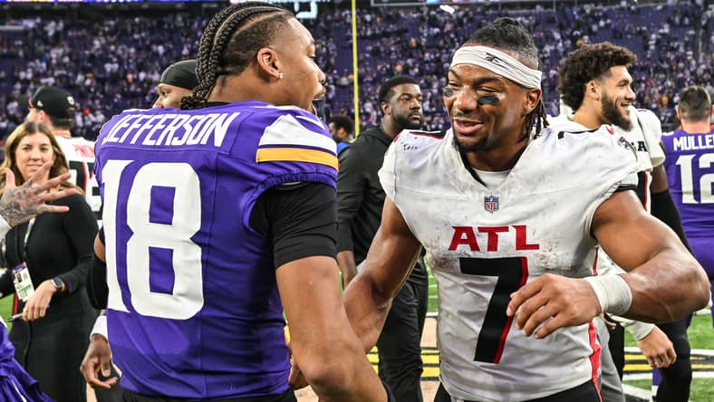 Bijan Robinson and Justin Jefferson greet each other after the Falcons–Vikings game at U.S. Bank Stadium.