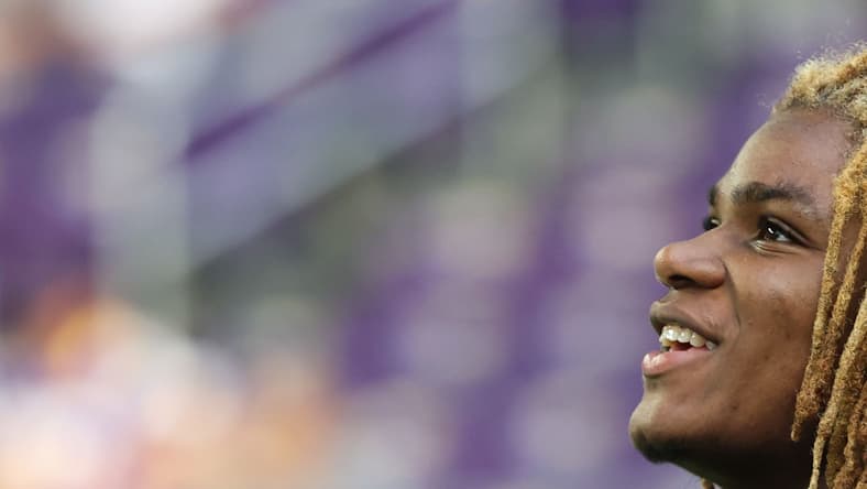 Lewis Cine looks on from the sideline before the Vikings’ preseason game against the 49ers at U.S. Bank Stadium.