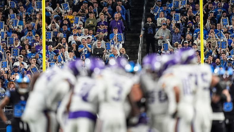 Detroit Lions fans cheer loudly as the Vikings offense lines up for a key third-down play at Ford Field.