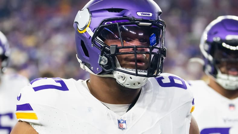Ed Ingram lines up on the offensive line for the Minnesota Vikings during a playoff game against the Los Angeles Rams.