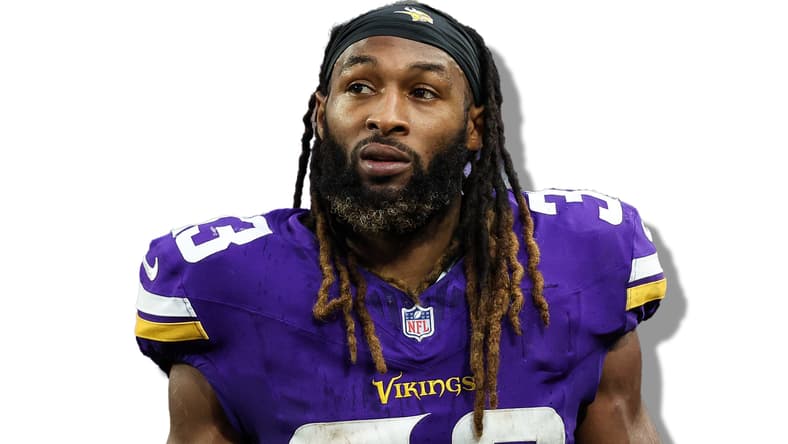 Aaron Jones looks on from the sideline during a Vikings home game
