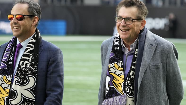Leonard Wilf and Mark Wilf stand on the field before a Vikings game in London. Nolan Teasley