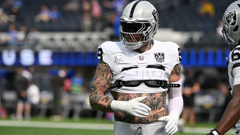 Maxx Crosby warms up on the field before a Raiders road game against the Rams.