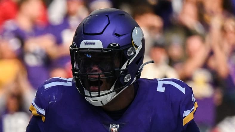 Minnesota Vikings' Dalvin Cook and Christian Darrisaw celebrate touchdown vs. Cardinals.