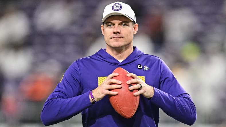 Kevin O’Connell standing on the sideline before Vikings game at U.S. Bank Stadium.