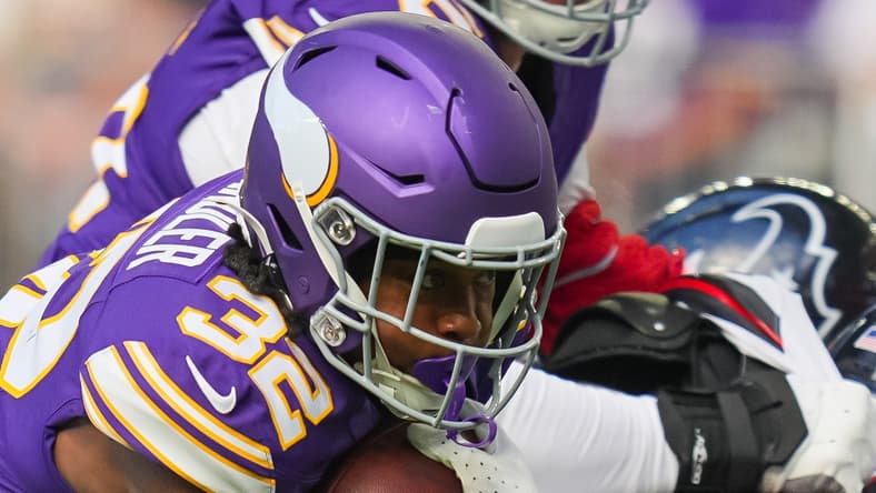 Vikings running back Ty Chandler runs with the ball against the Houston Texans at U.S. Bank Stadium.