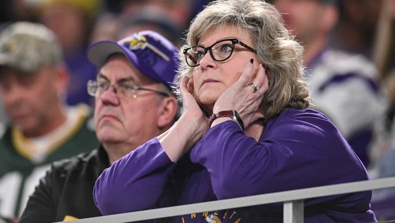 Vikings fans react in the stands during a game against the Packers at U.S. Bank Stadium