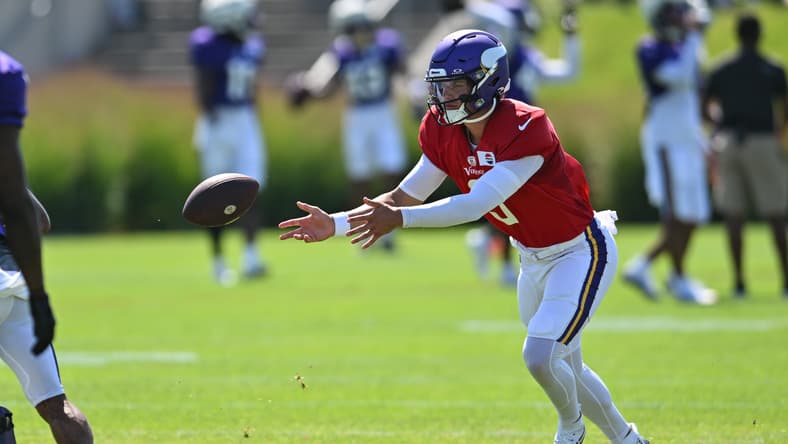 J.J. McCarthy warms up during Minnesota Vikings training camp practice in Eagan.
