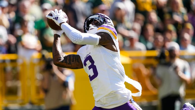 Jordan Addison catches touchdown pass against Packers at Lambeau Field.