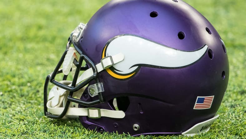 A Minnesota Vikings helmet rests on the field before a home game against the Chicago Bears.