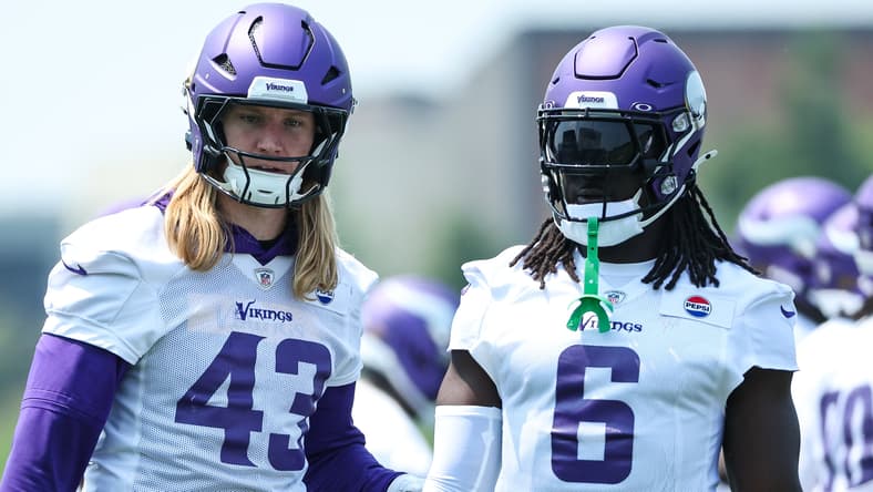Andrew Van Ginkel and Brian Asamoah stand on the field during Vikings minicamp. Vikings free agents 2027