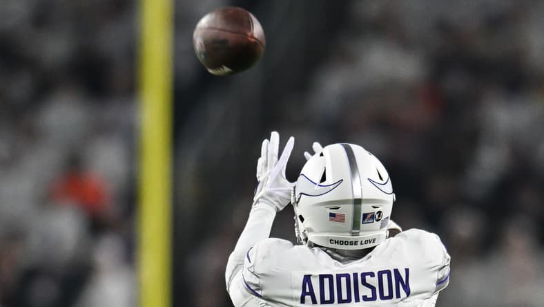 Minnesota Vikings wide receiver Jordan Addison catches a pass while defended by Chicago Bears cornerback Terell Smith at U.S. Bank Stadium.