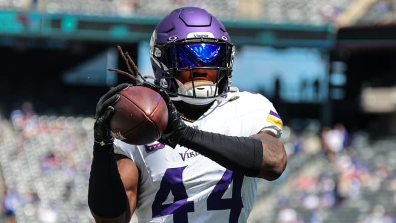 Josh Metellus catches a football during pregame warmups before the Vikings faced the New York Giants. Vikings players