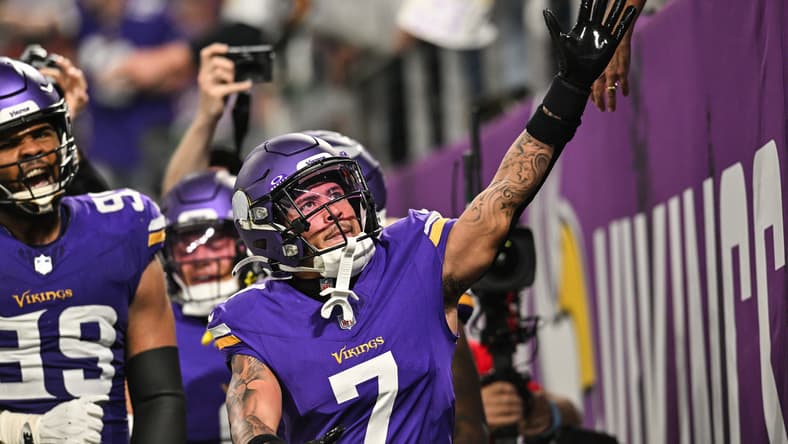 Byron Murphy Jr. reacts with fans after intercepting Joe Flacco against the Colts in 2024.