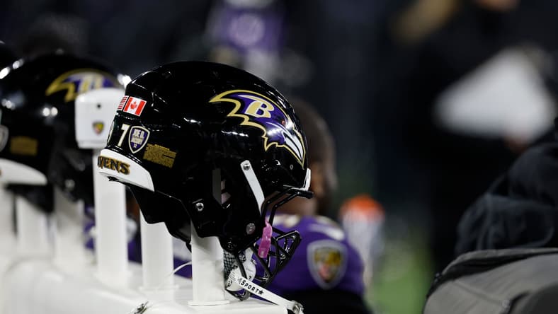 Baltimore Ravens helmets on a heated bench during a playoff game