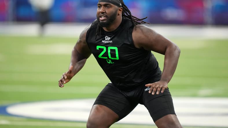 Donovan Jackson performs drills during the NFL Scouting Combine in Indianapolis.