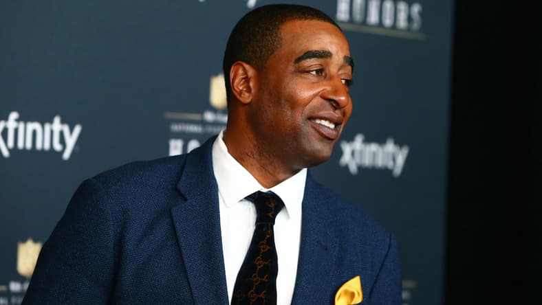 Cris Carter walks the red carpet at the NFL Honors ceremony in Phoenix.