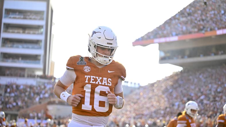 Arch Manning takes the field for Texas before the CFP playoff game vs. Clemson in 2024.