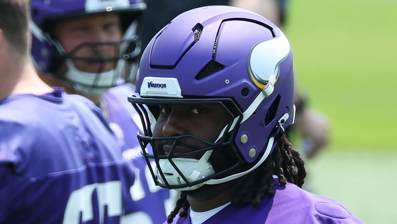 Donovan Jackson participates in Vikings minicamp drills at the team facility in Minneapolis