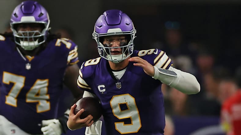 J.J. McCarthy runs the ball during a Vikings game against the Falcons at U.S. Bank Stadium.